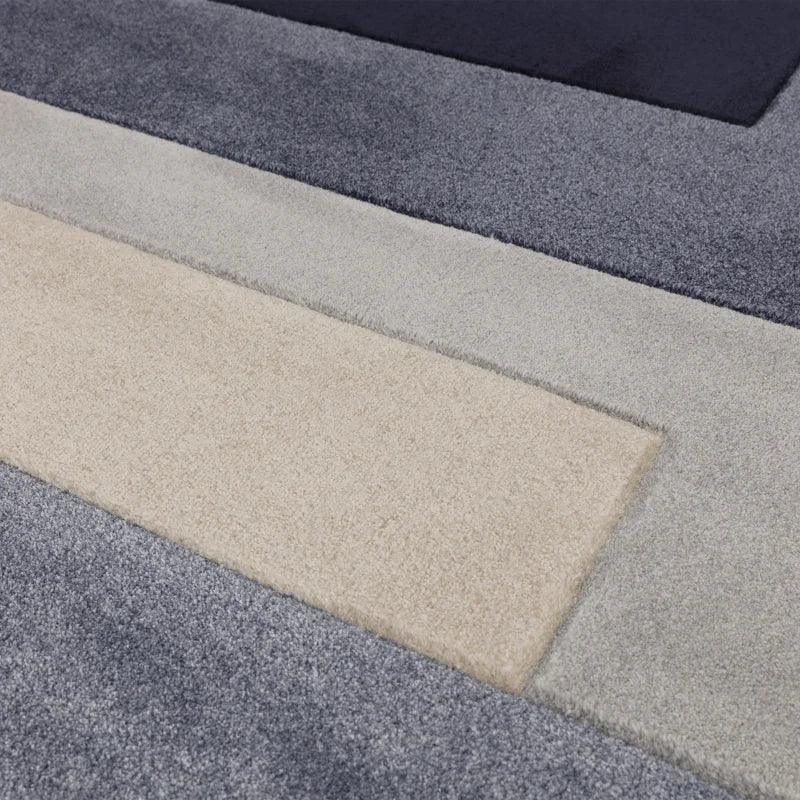 Rectangular grey and beige modern area rug with soft pile and geometric pattern