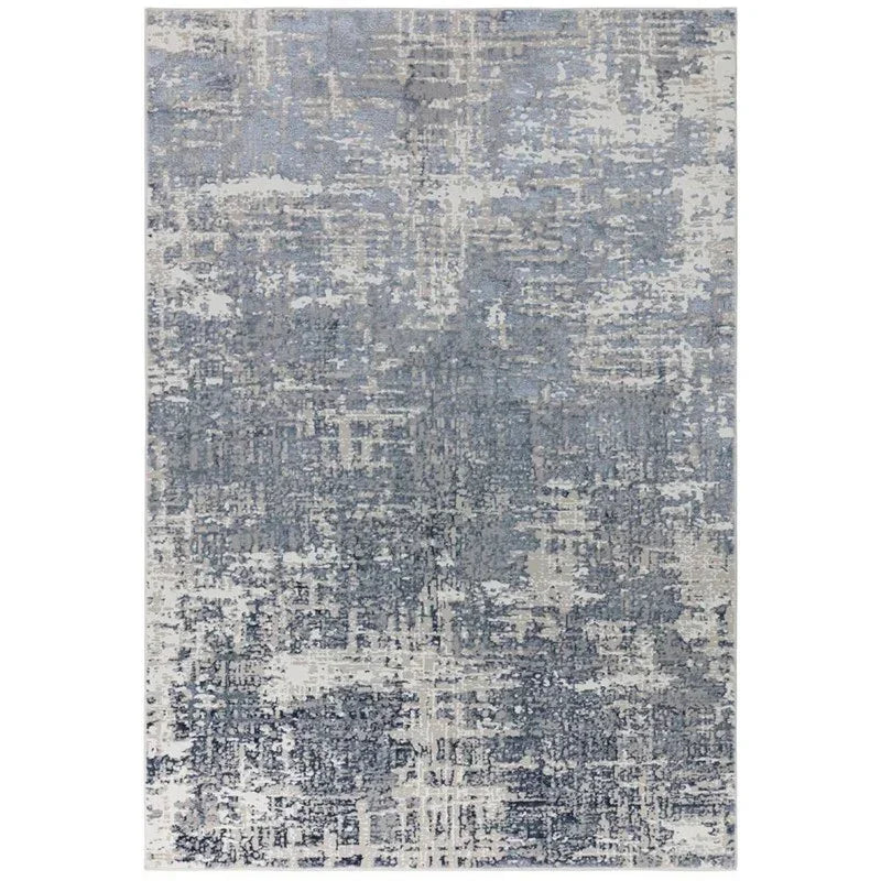 Abstract blue and grey area rug with textured pattern and soft pile