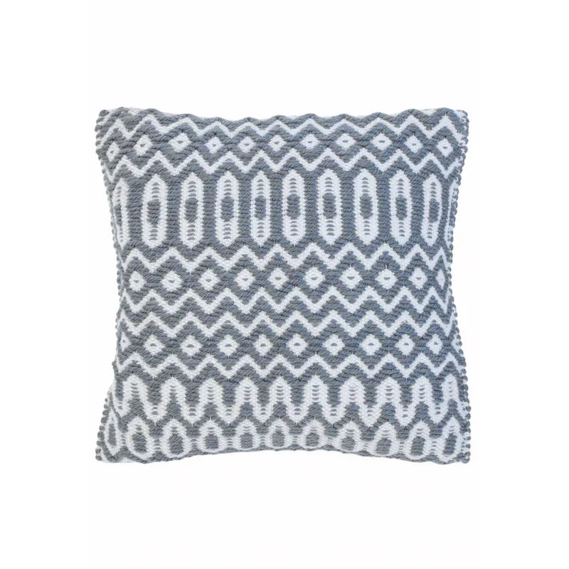 Grey and white patterned cushion with textured zigzag and diamond design