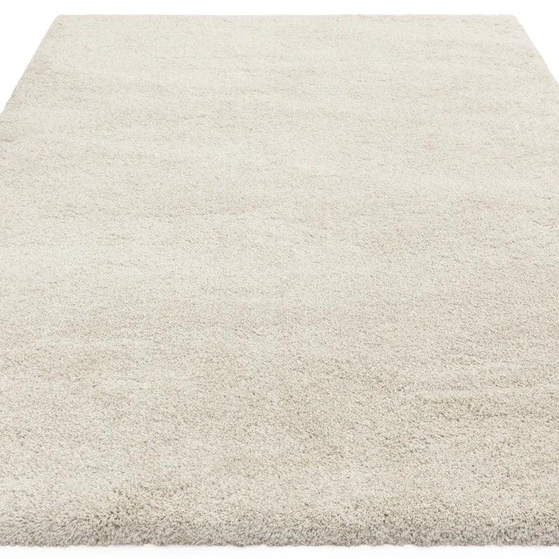 Cream shaggy area rug with soft pile and rectangular shape