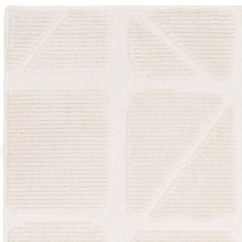 Cream textured rug with geometric pattern and raised rectangular sections