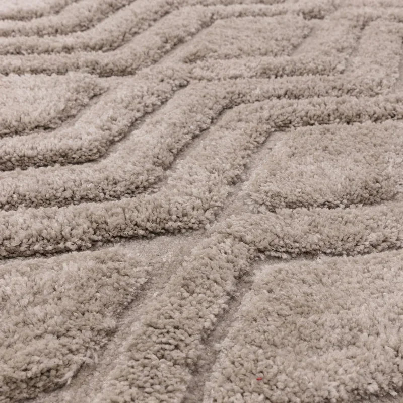 Close-up of textured beige geometric rug pile