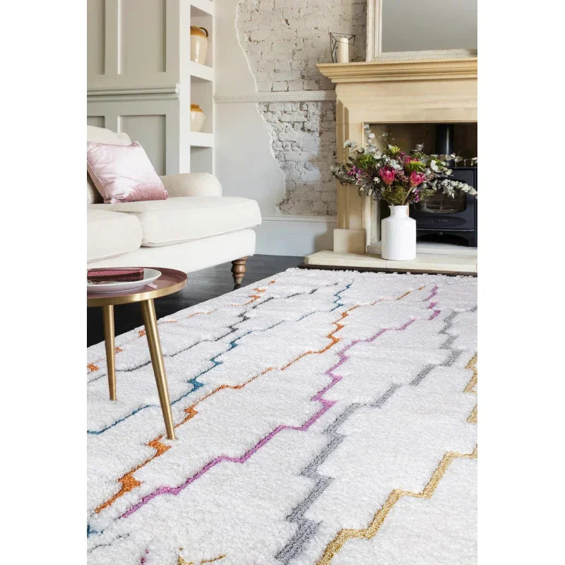 White geometric living room rug with multicolour zigzag lines on wooden floor