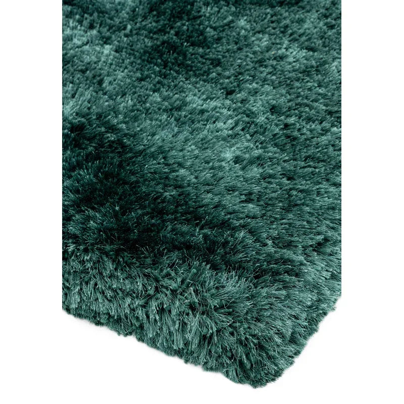 Green shaggy rug closeup showing plush pile and soft texture