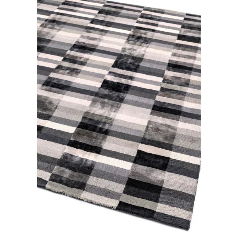 Grey checkered area rug with textured stripes and contemporary design