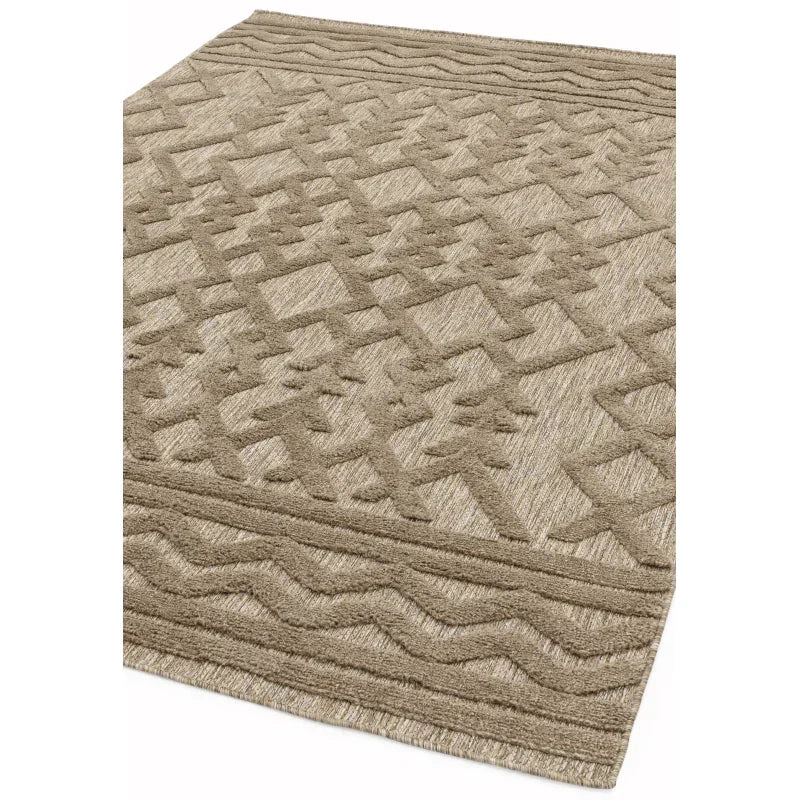 Beige textured rug with raised geometric pattern and wavy border detail at the corner