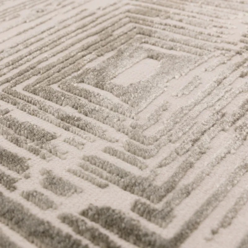 Beige geometric pattern rug with raised texture and soft pile detail