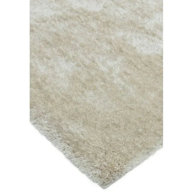 Beige shaggy rug closeup showing soft pile and corner detail