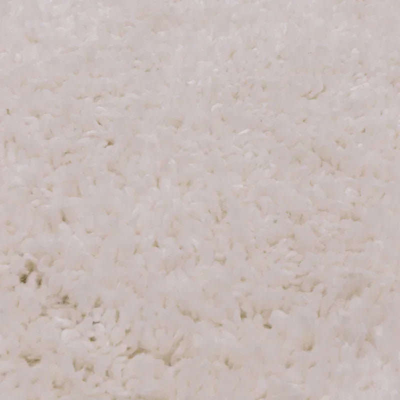 Close view of white shaggy rug texture with soft pile