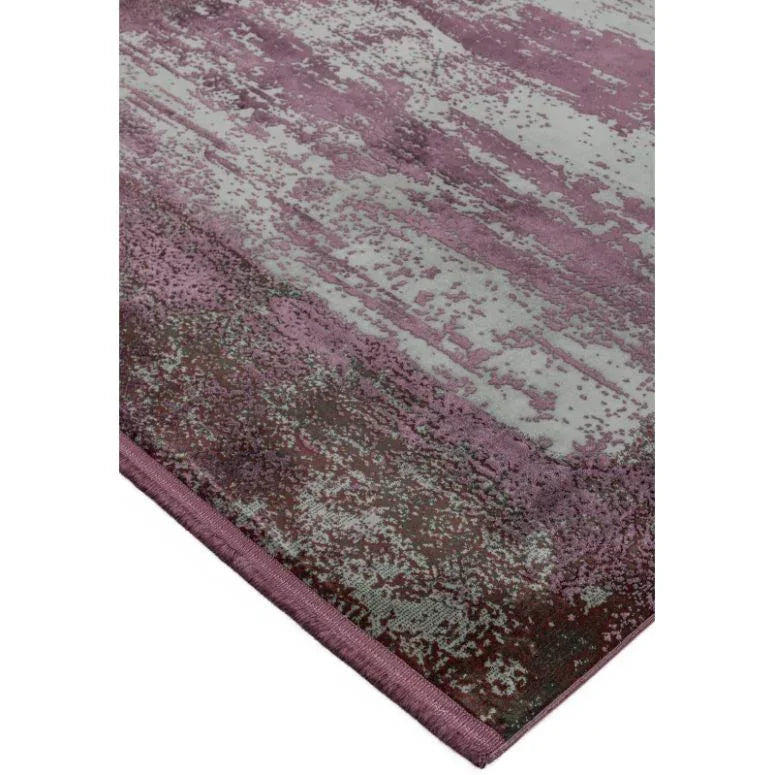 Purple abstract area rug with textured pattern and stitched edge, corner view