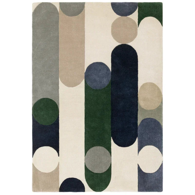 Modern geometric area rug with cream, blue, green and beige shapes, top view