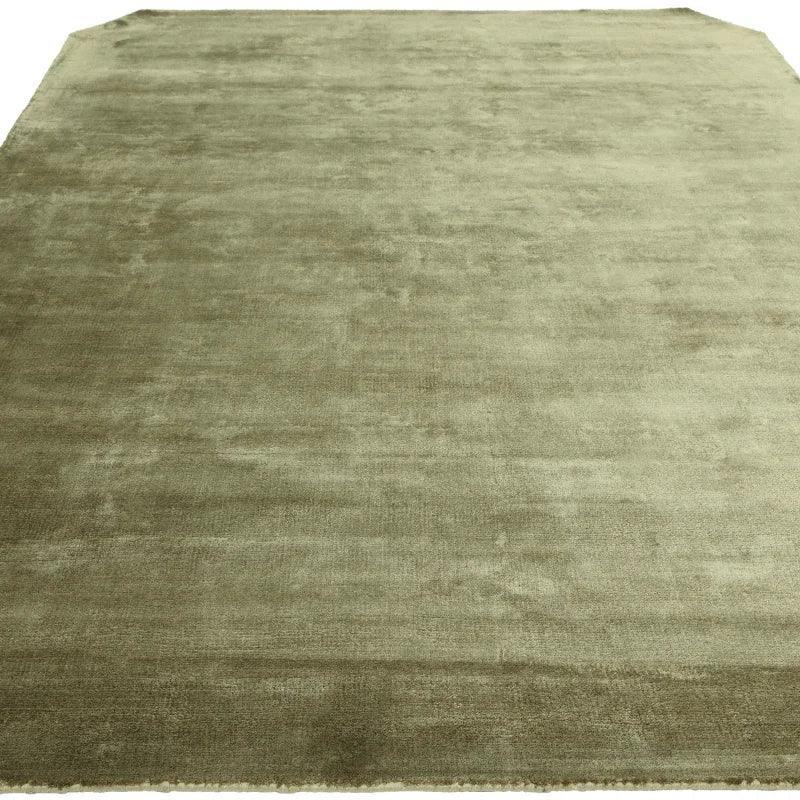 Plain light green area rug with soft, plush texture and rectangular shape
