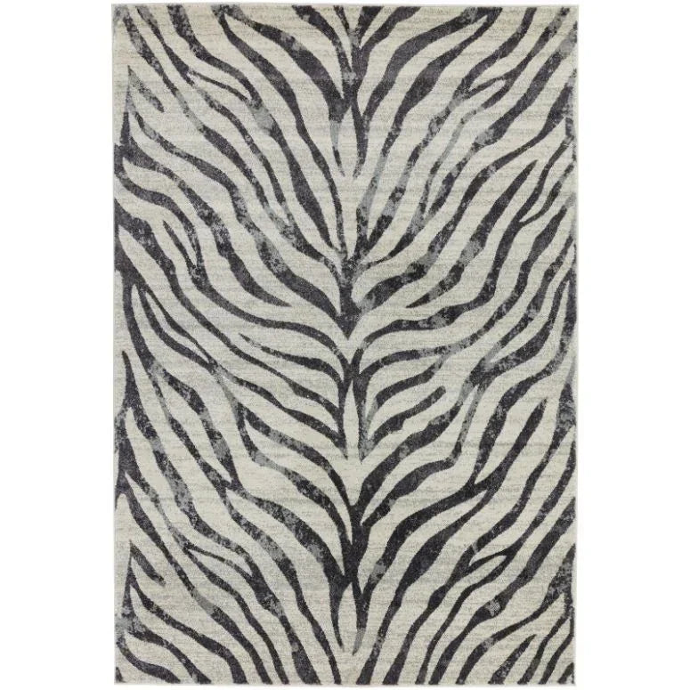 Neutral area rug with black and grey zebra stripe pattern, rectangular shape