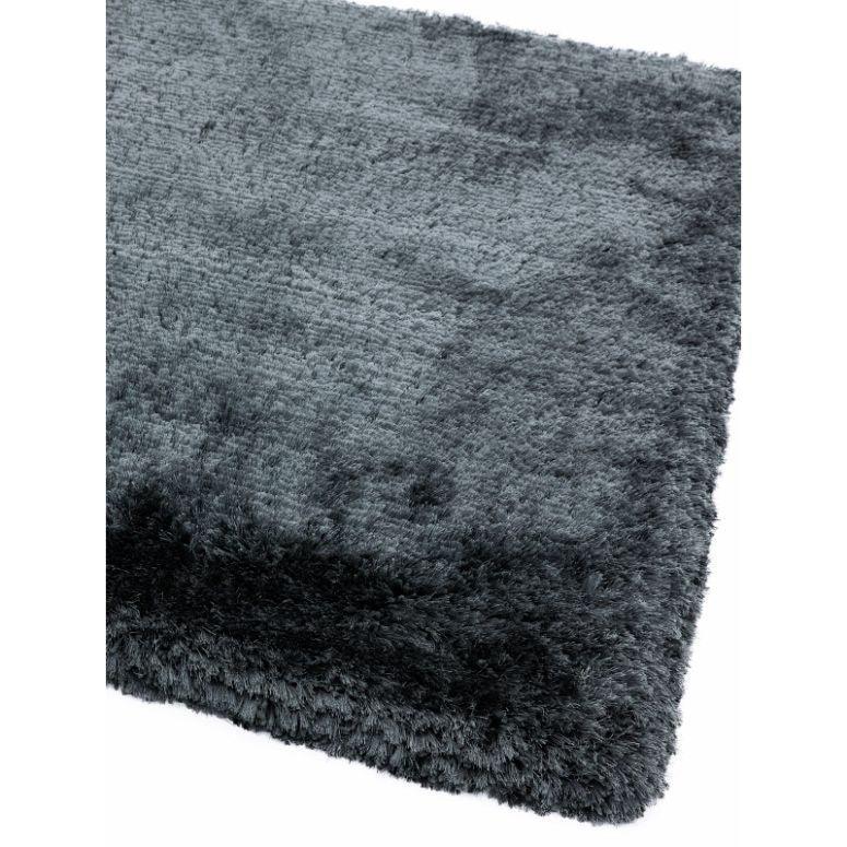Dark grey shaggy rug close-up showing plush texture and thick pile