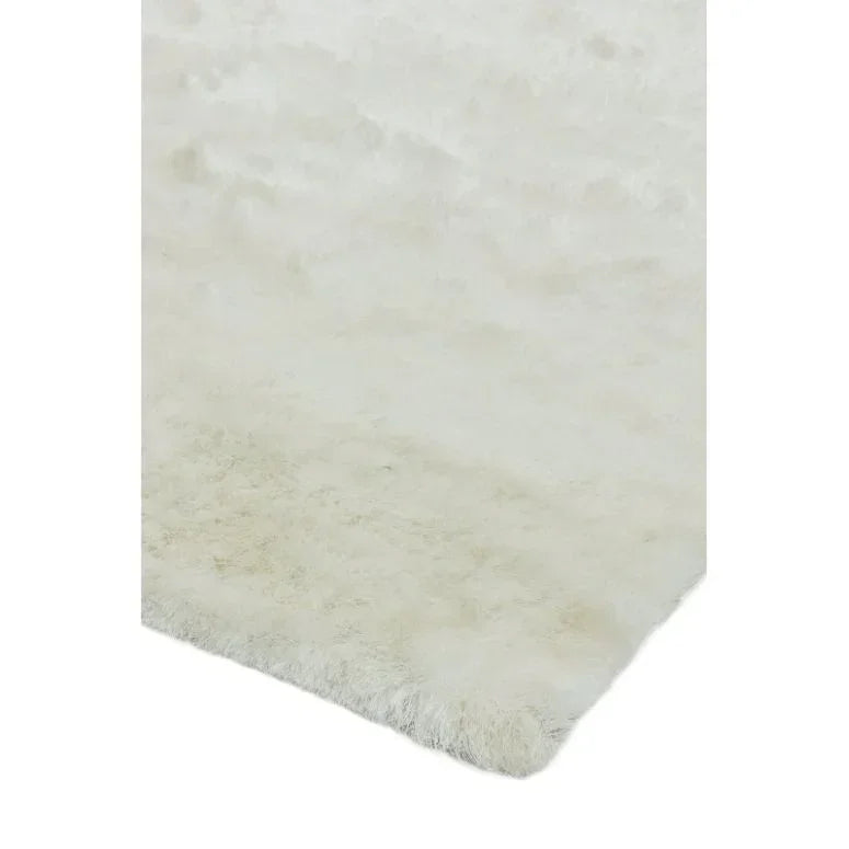 White fluffy rug closeup showing soft texture and plush pile