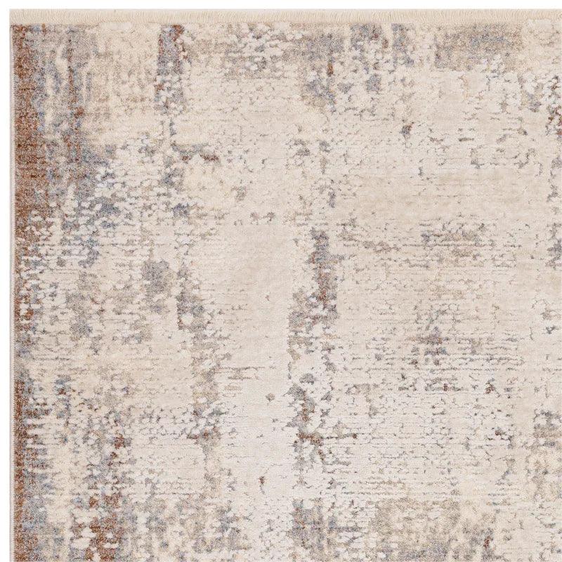 Modern beige area rug with abstract pattern and textured finish