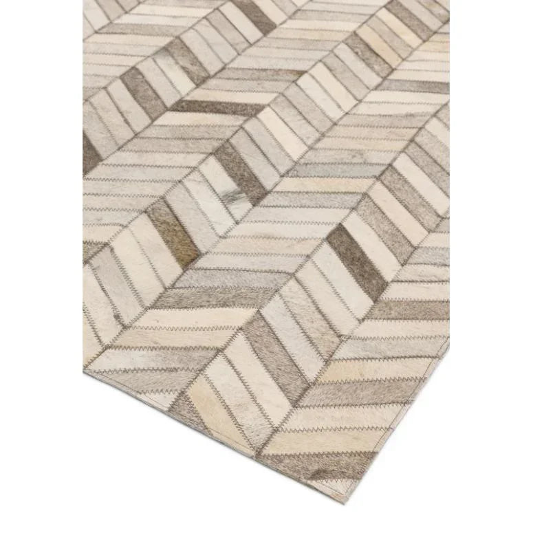 Beige geometric area rug with stitched patchwork pattern in contemporary style