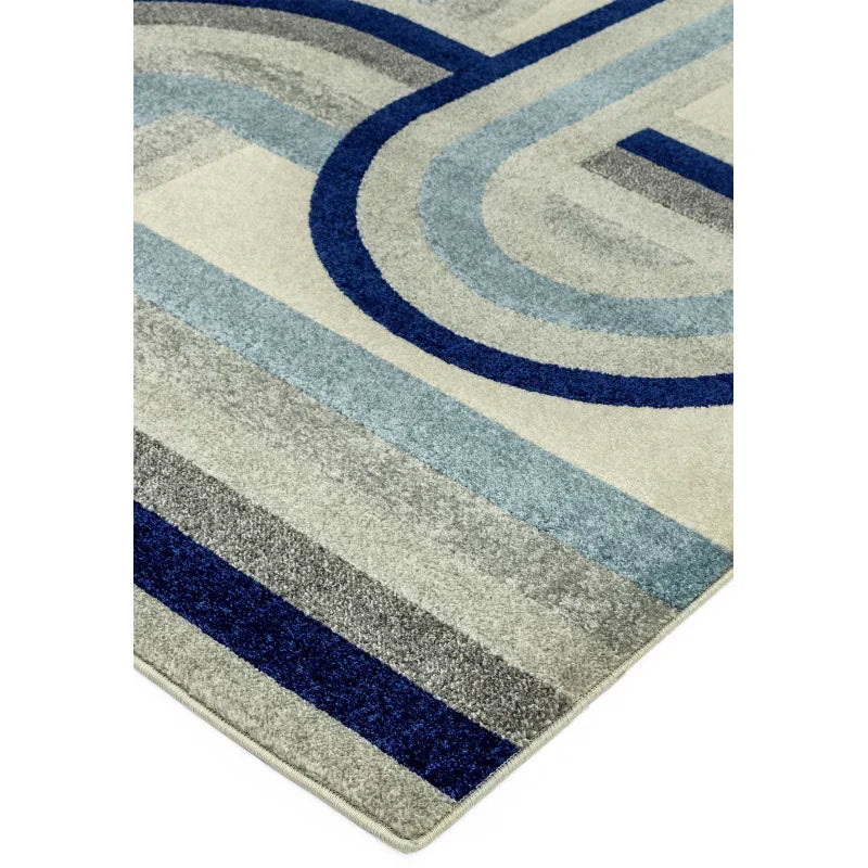 Modern area rug with blue and grey geometric pattern and soft textured finish