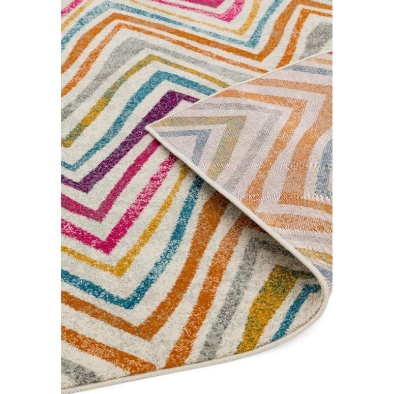 Multicolour geometric rug with angled stripes in pink, blue, orange, and yellow on white