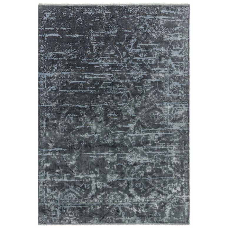 Dark grey patterned area rug with distressed texture and subtle abstract detailing
