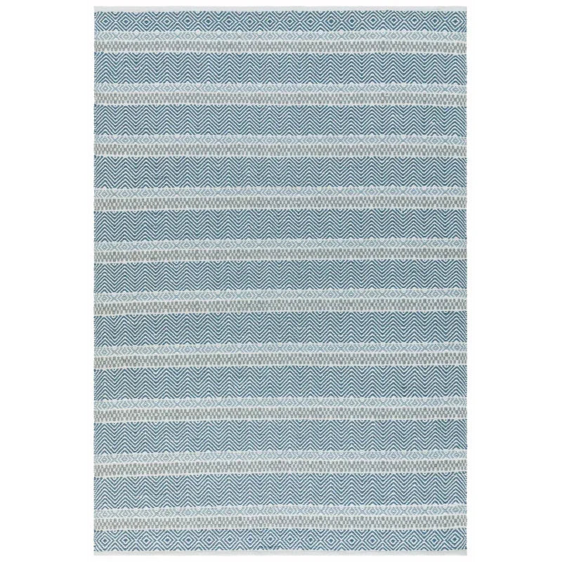 Blue patterned rug with geometric and wavy stripes, flatwoven for modern living room decor