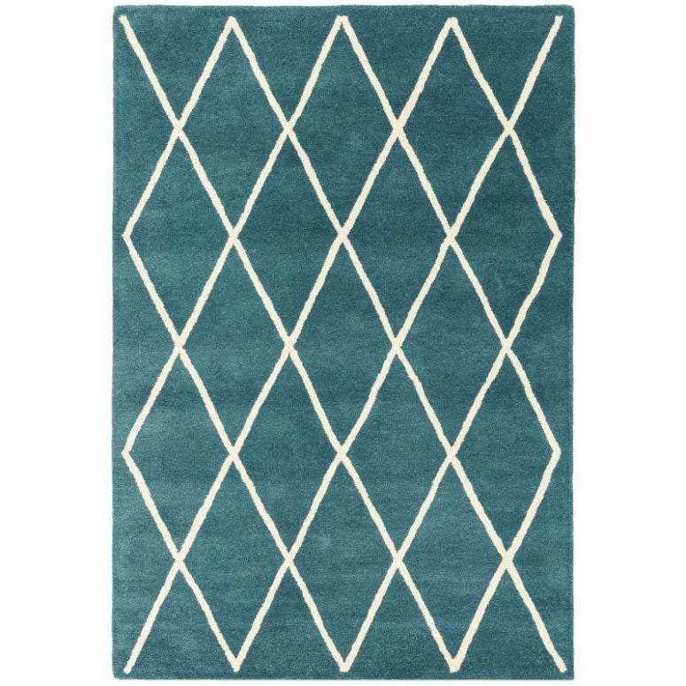 Teal area rug with white diamond lattice pattern and plush texture
