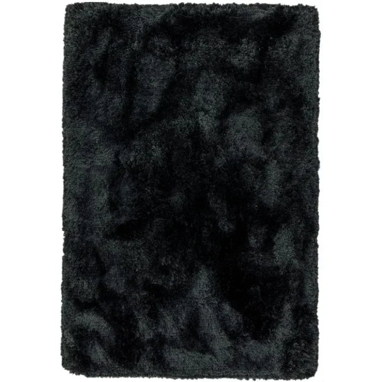 Black shaggy area rug with soft plush pile and rectangular shape, top view