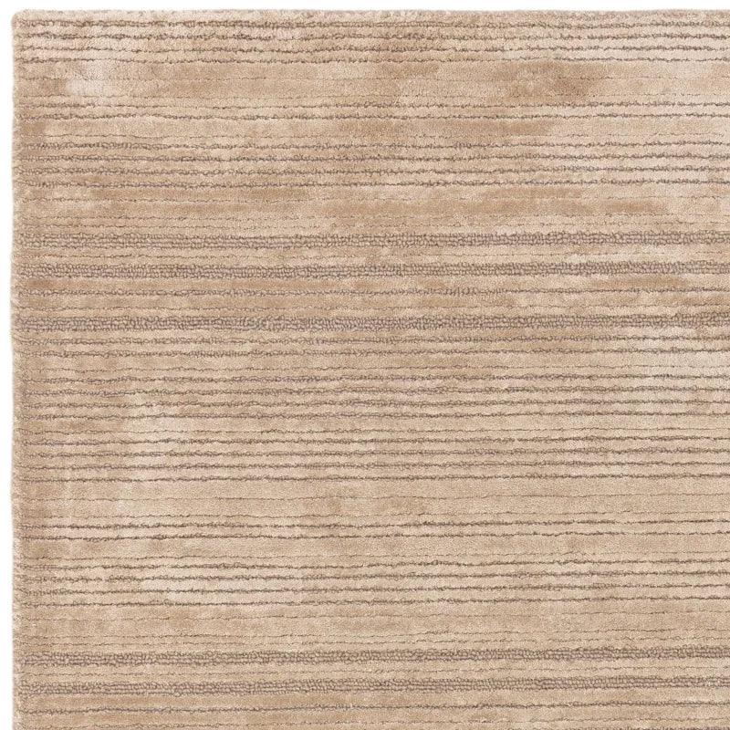 Beige striped area rug with textured pile and horizontal line pattern