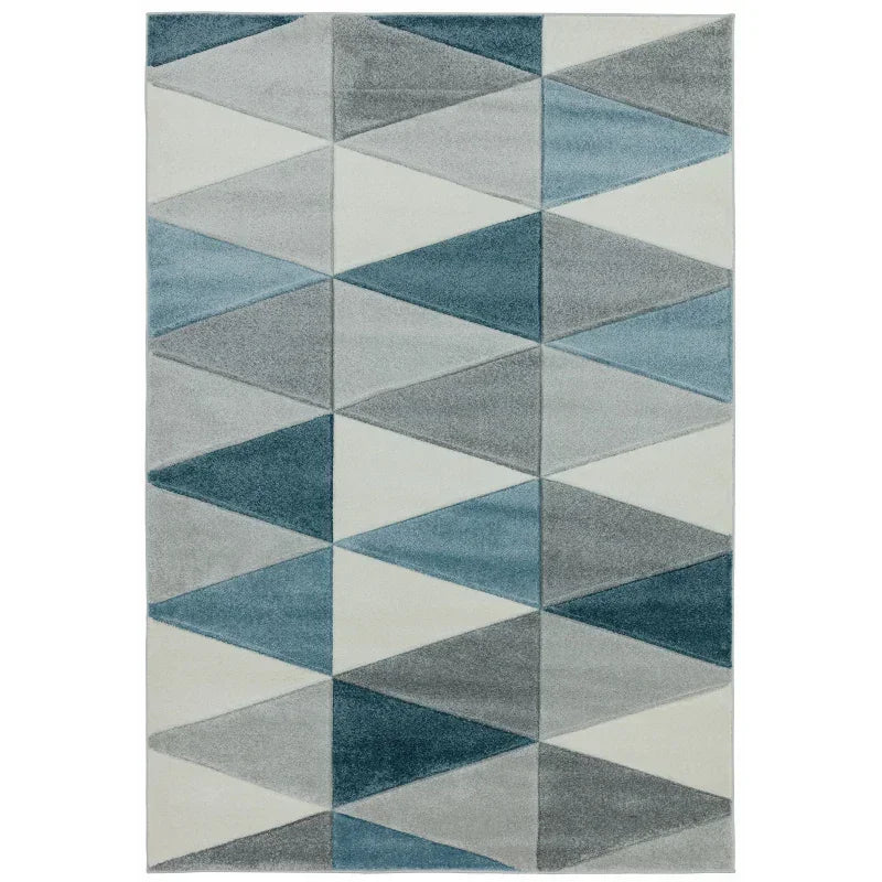 Modern area rug with blue, grey, and white geometric triangle pattern