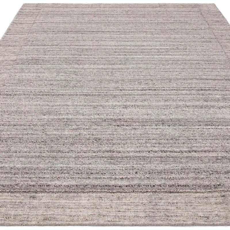 grey textured area rug with subtle pattern, rectangular shape, displayed flat