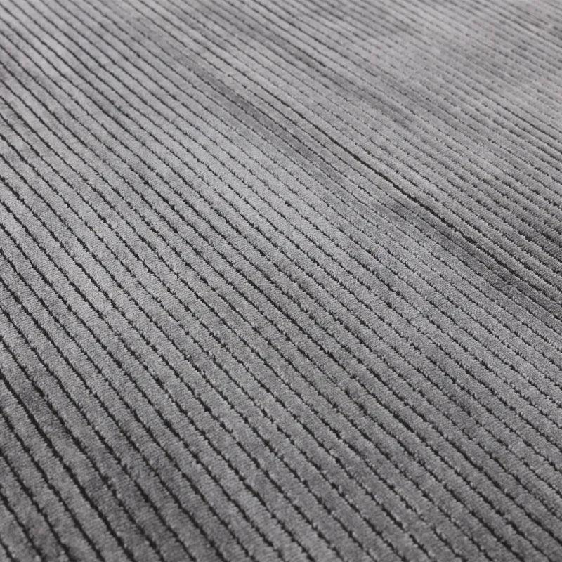 Closeup of grey corduroy sofa fabric texture with soft ribbed pattern