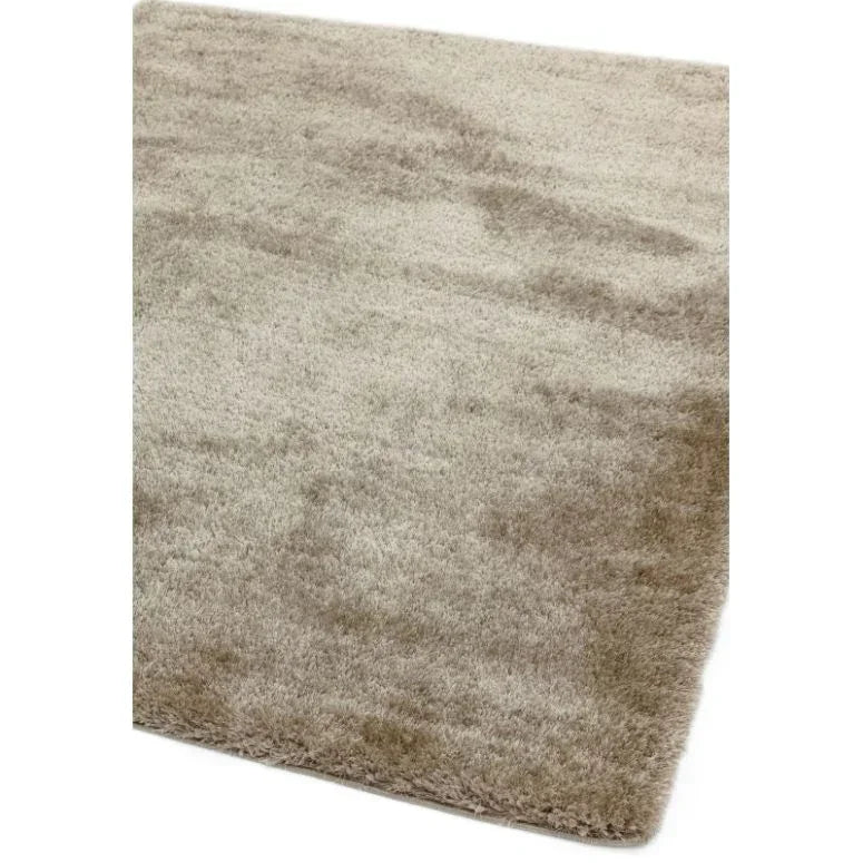 Beige shaggy area rug with soft, thick pile texture and straight edges