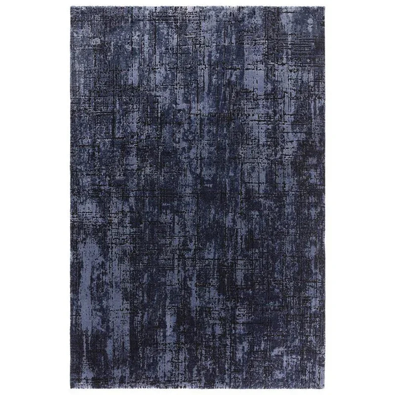 Navy blue abstract pattern area rug with textured design