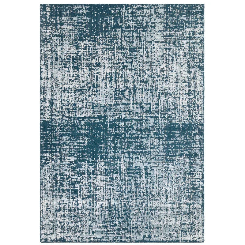 blue abstract pattern area rug with textured design