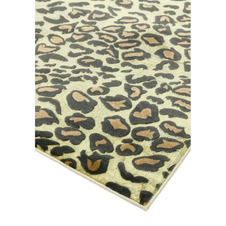 Leopard print area rug with beige, brown and black pattern, close corner view