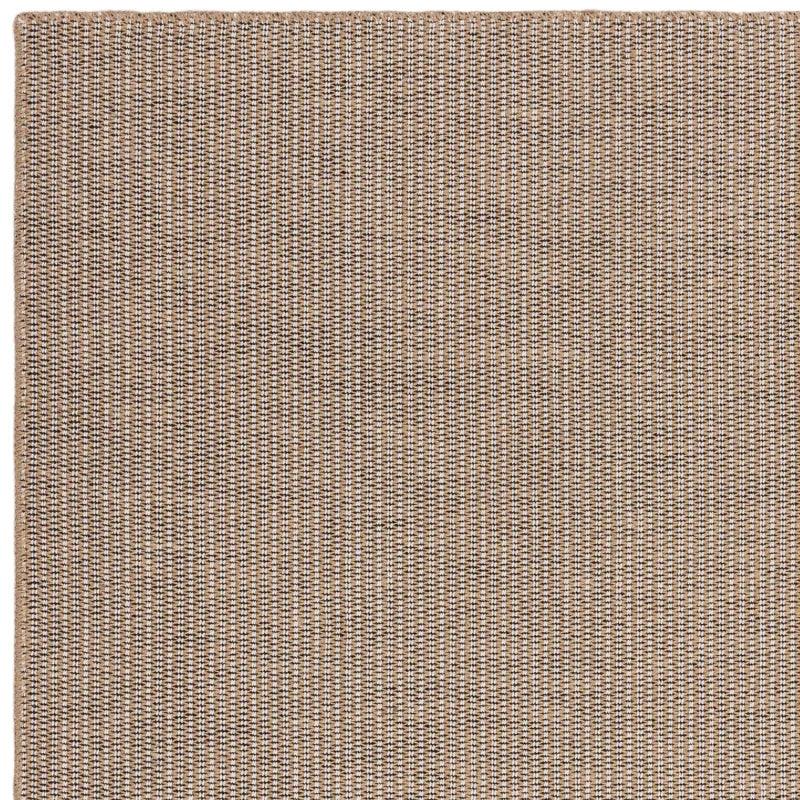 Beige woven area rug with textured detail and corner edge visible