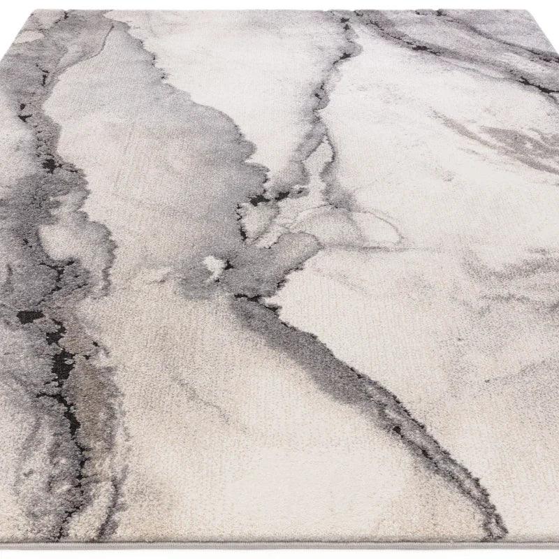 Grey marble effect area rug with abstract pattern and soft texture