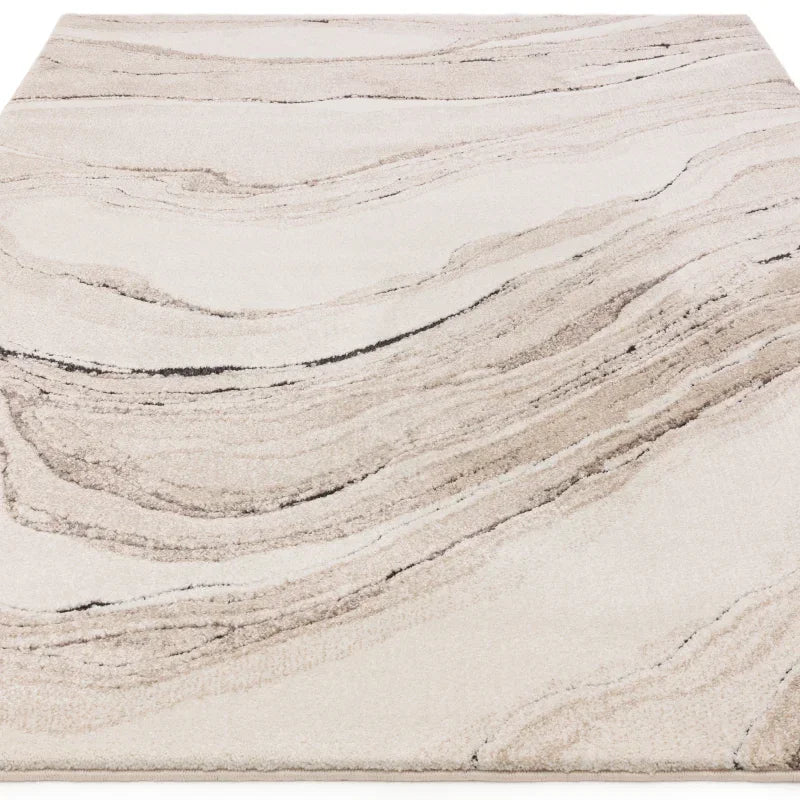 Beige and cream area rug with abstract marble pattern and soft texture