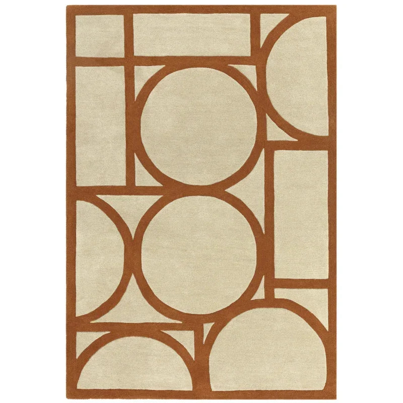 Modern area rug with tan background and bold brown geometric pattern of circles and rectangles