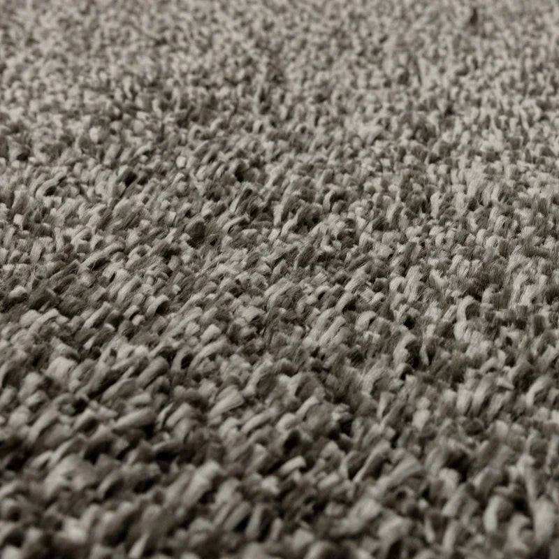 Close-up view of grey textured carpet fibers for living room or bedroom floor covering