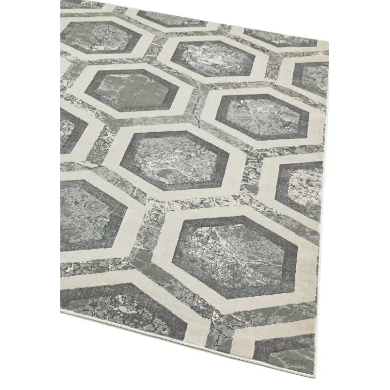 Grey geometric rug with octagon pattern and marbled texture, angled corner view