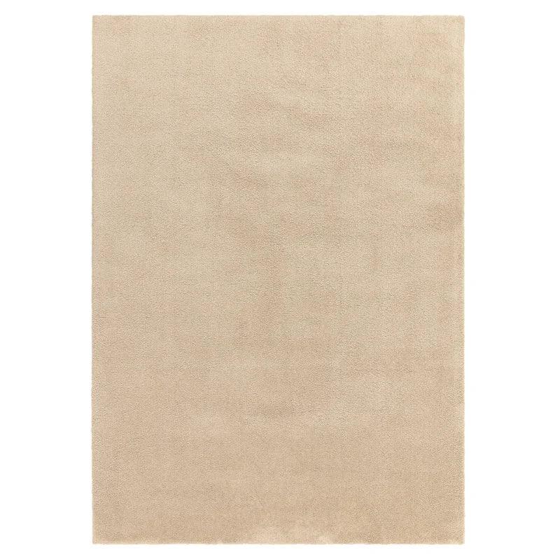 beige area rug with soft texture and rectangular shape shown from above