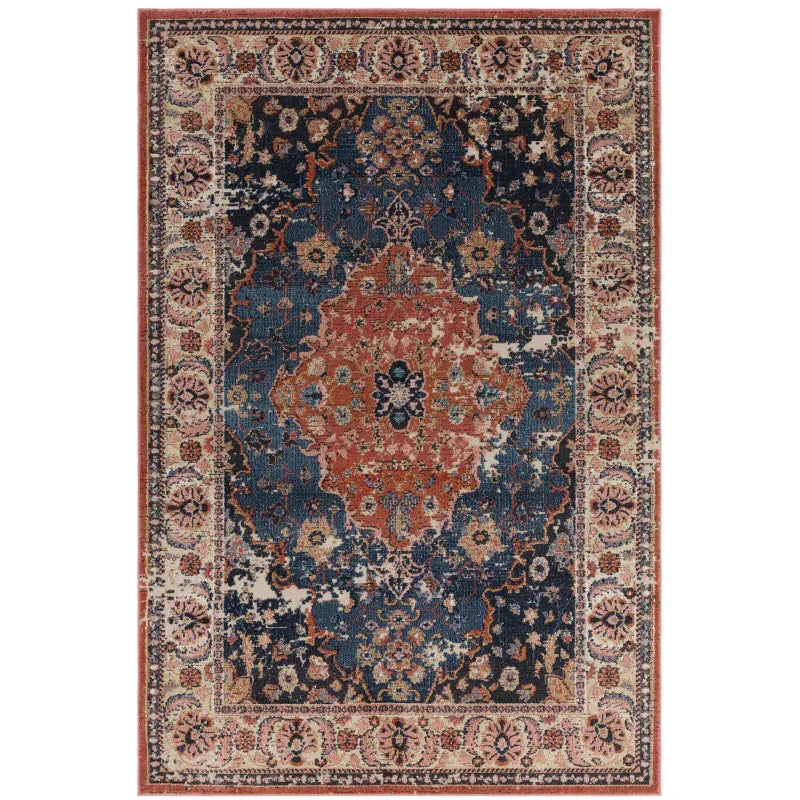 Traditional area rug with blue, rust and cream floral medallion pattern and ornate border