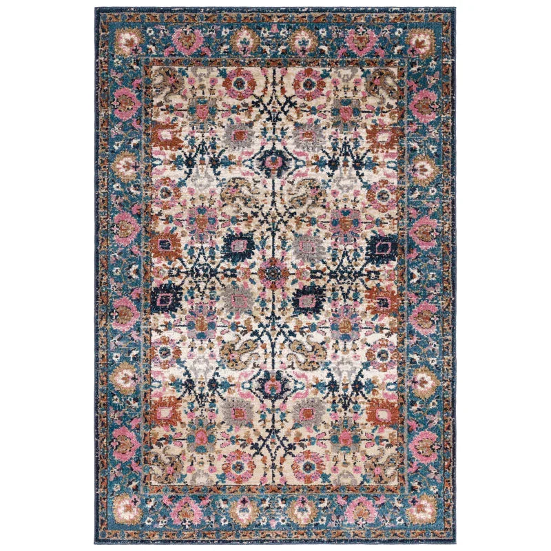 Traditional area rug with floral patterns in blue, pink and beige, full top view