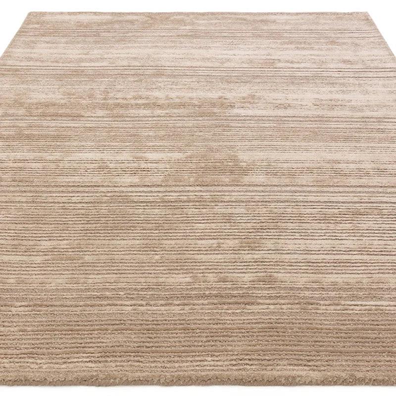 Beige textured area rug with horizontal stripe pattern, shown from above angle