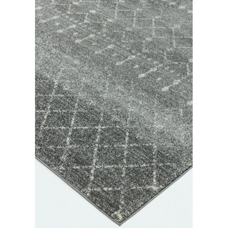 Grey area rug with subtle geometric pattern and soft texture, corner angle view