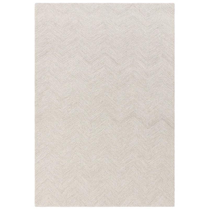 Cream patterned area rug with subtle chevron texture, shown from top-down angle
