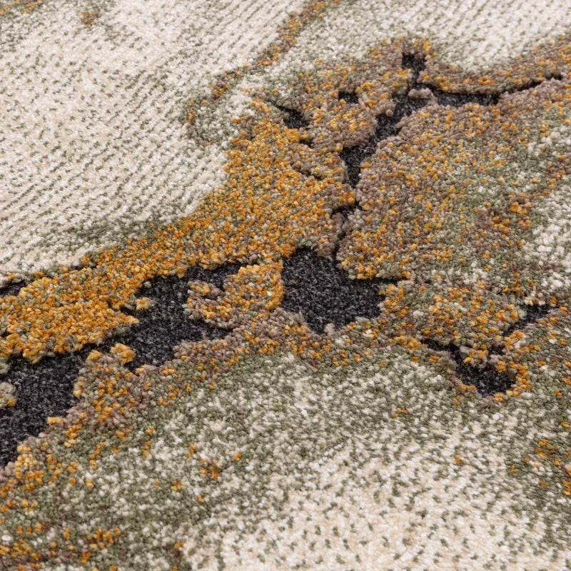 Close-up of textured modern rug with beige, grey, olive green and mustard accents
