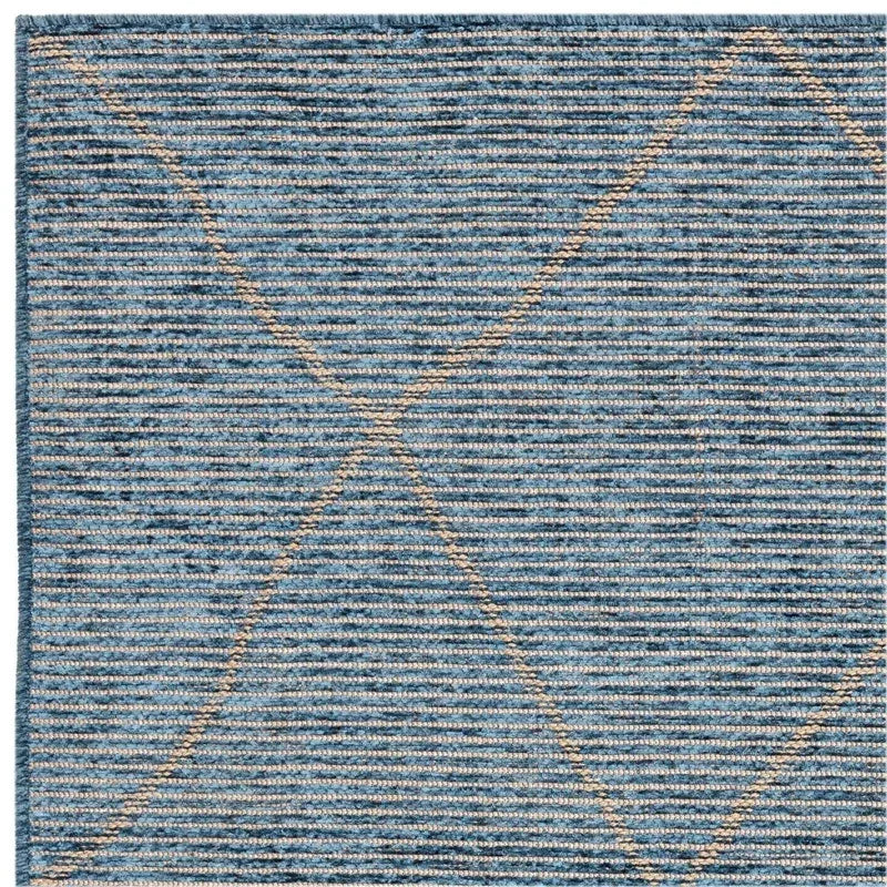 blue textured rug with cream geometric lines, close-up showing woven detail