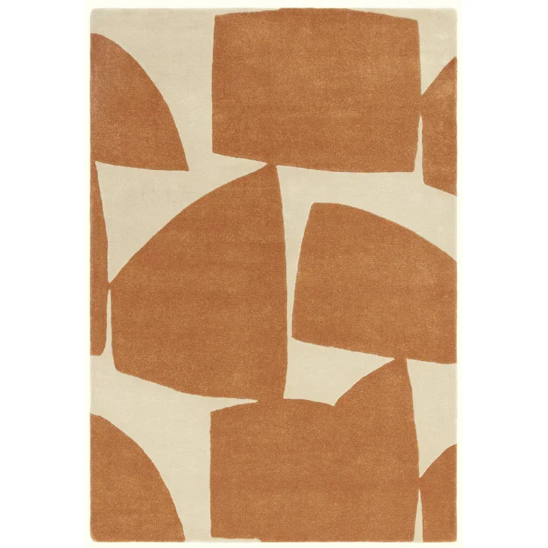 Modern area rug with tan abstract geometric pattern on cream background